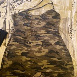 Army style romper with spaghetti strap and a criss cross back.